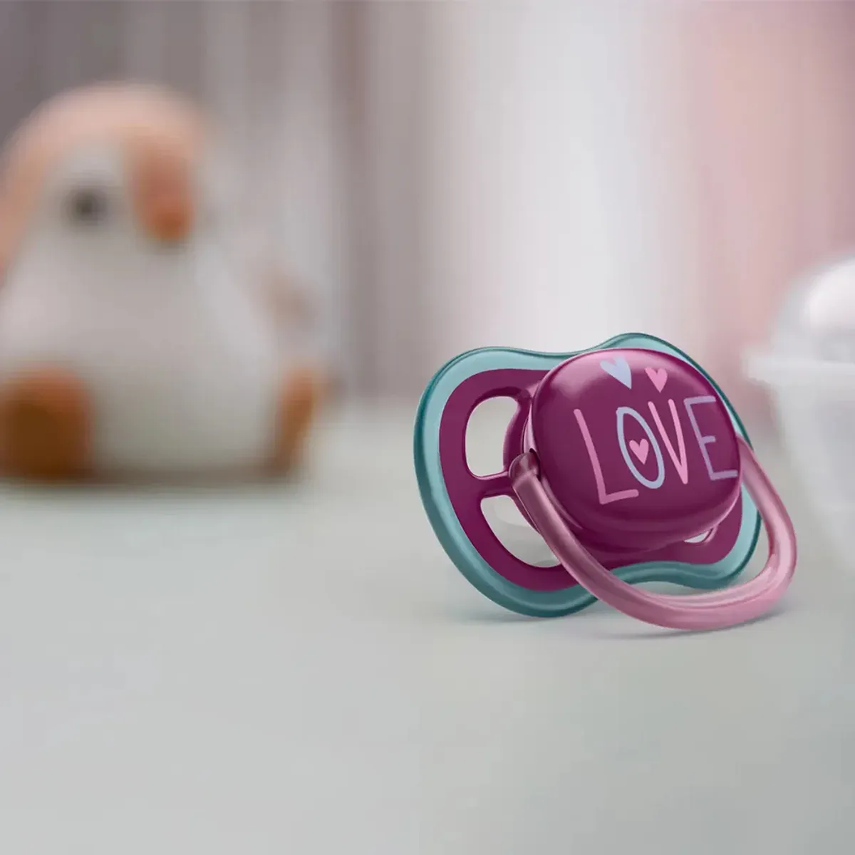 دو پستانک ultra air فیلیپس اونت صورتی و آبی با طرح فیل و LOVE از روبه‌رو